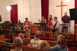 AA stained glass leading worship